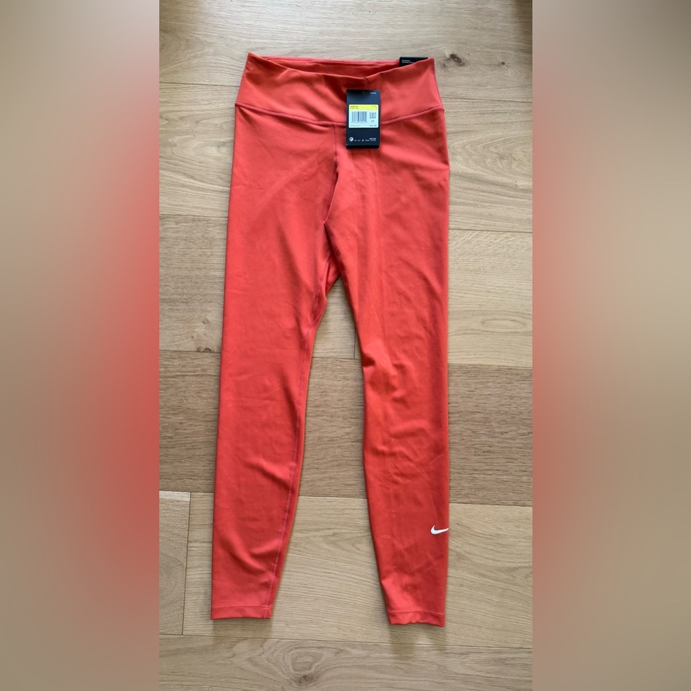 The Nike One Tight Fit Leggings SIZE S- Orange